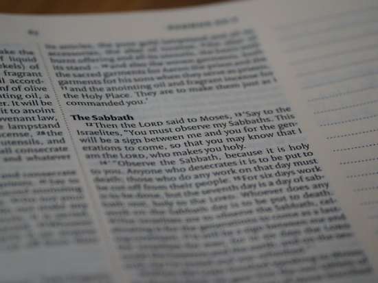 The verse in the bible saying about the sabbath A Bible opened to the passage that talks about God's Sabbath commandment.