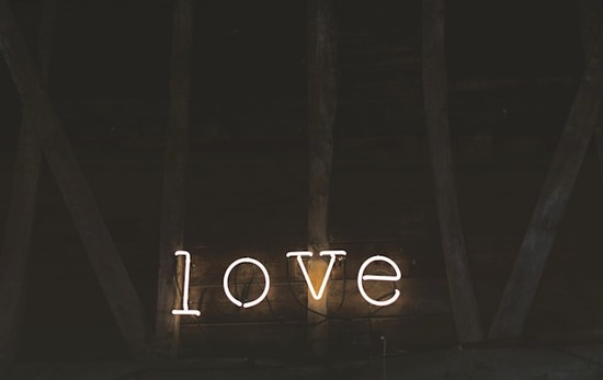 A neon sign reading, 'love.'