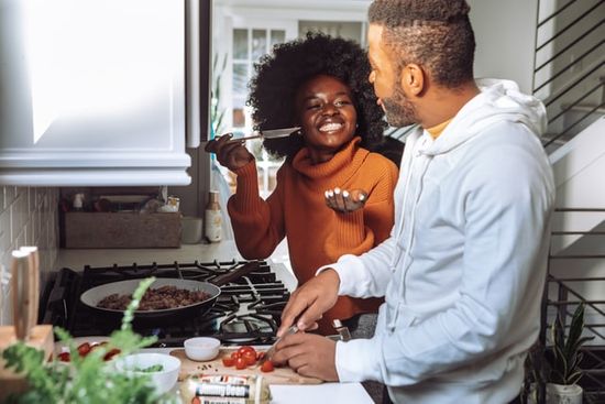 Meal Preparation A couple cooking food on Friday to prepare for Sabbath