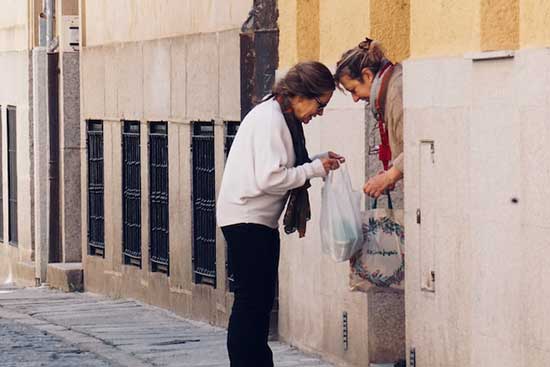 Adventist Christians applying the Bible by serving and distributing food to others