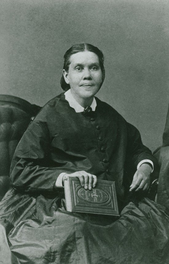 Ellen White with a Book A portrait of Ellen White holding a book.