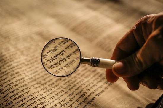 Examining the Torah with a magnifying glass The Hebrew Torah has so much depth that it would make sense to study it with a magnifying glass! Every jot and tittle are there for a reason.