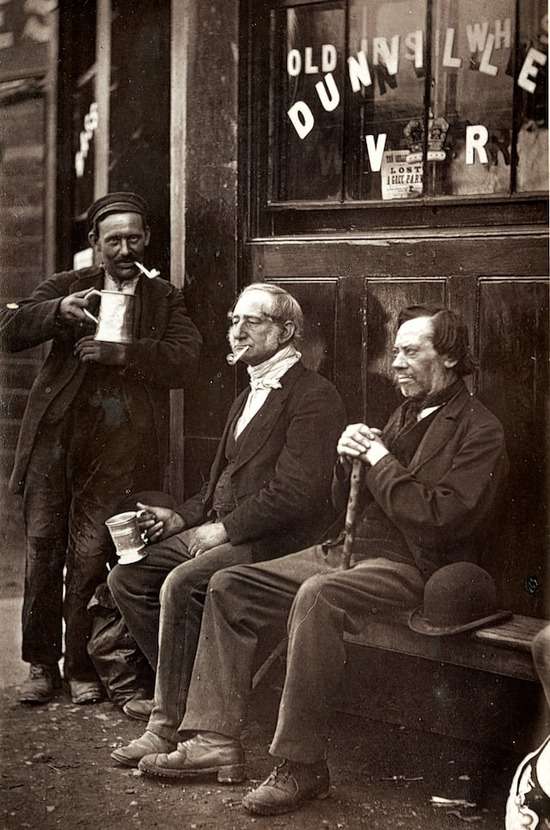 Men from Ellen White's time smoking pipes and drinking beer outside a shop.