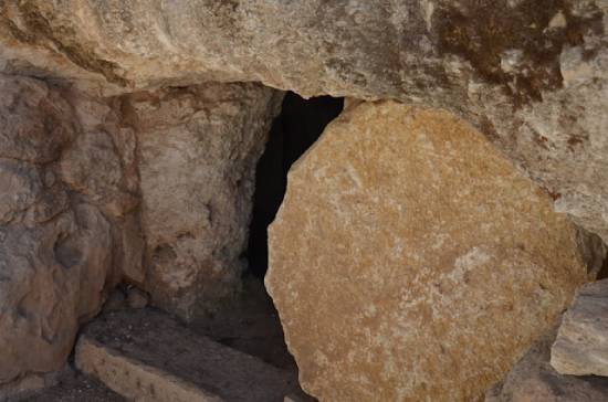 A tomb with the stone rolled away, illustrating the resurrection of Jesus Christ.