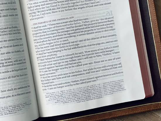 A Bible opened to The Parable of the Prodigal Son