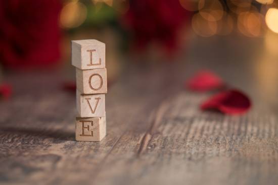 Wooden blocks that spell "love" stacked on top of each other Wooden blocks that spell "LOVE" are stacked on top of one another, reminding us that God's love for us is the reason He forgives.
