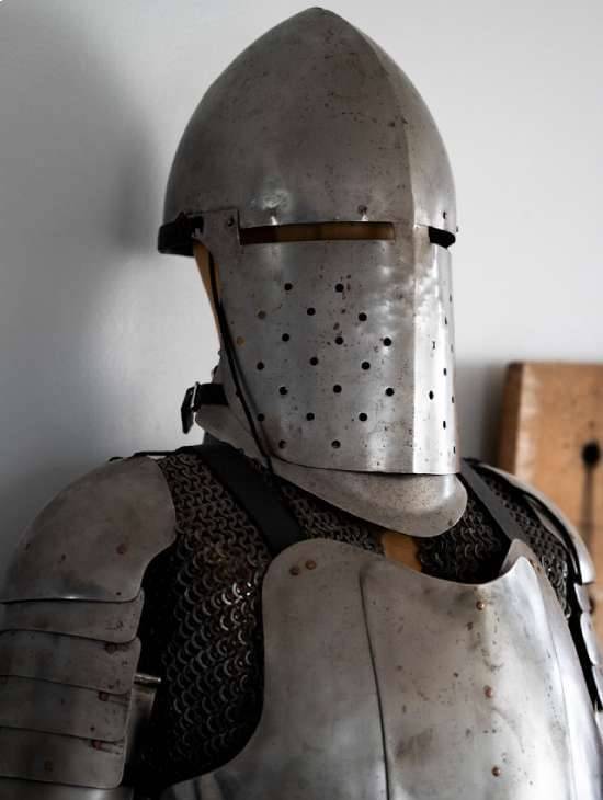 A standing suit of medieval armor.