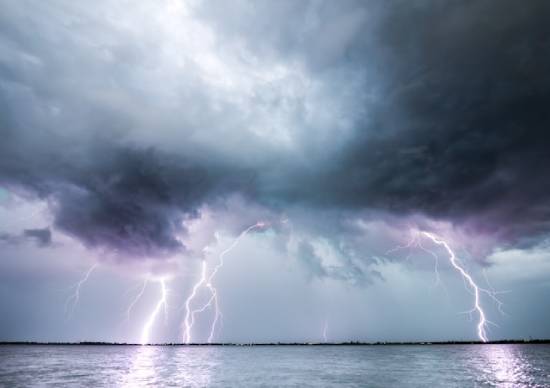 A lightning storm gathering over the ocean