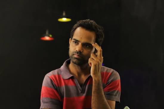 A man scratching his head in thought