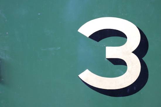 The number 3 in white with a blue shadow on a green background, signifying Mark's patterns of 3's