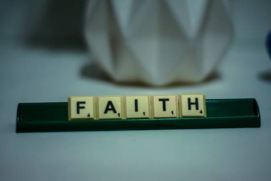 Scrabble letters spelling out the word 'faith'