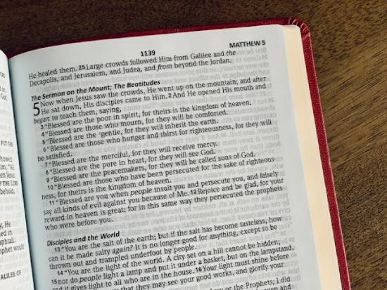 A Bible opened to the story of The Beatitudes in the book of Matthew.