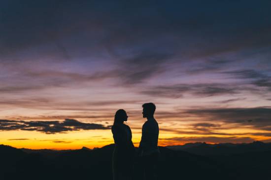 A couple holding A couple holding hands in the sunset, reminding us that God made man and woman to reflect the glory of God