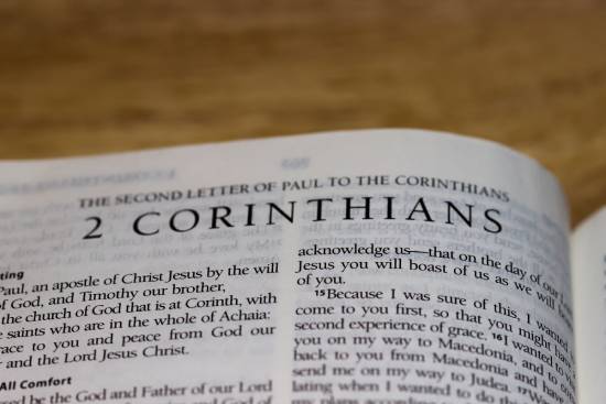 Bible open to 2 Corinthians A Bible opened to the book of 2 Corinthians