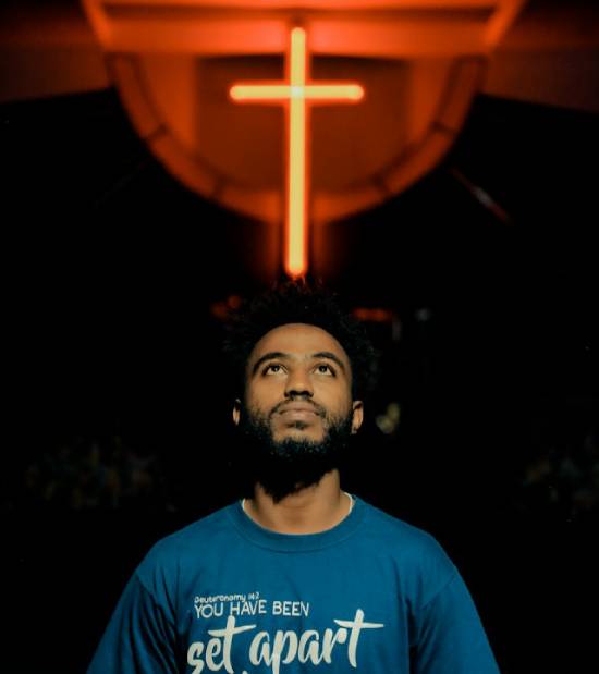 Man looking up to Cross Man look up to the Cross as we learn from the mistakes of the judges and get a glimpse of God's incredible mercy towards us.